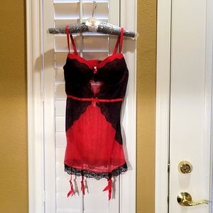 Frederick's Of Hollywood Lacey Cami with Garters attached.